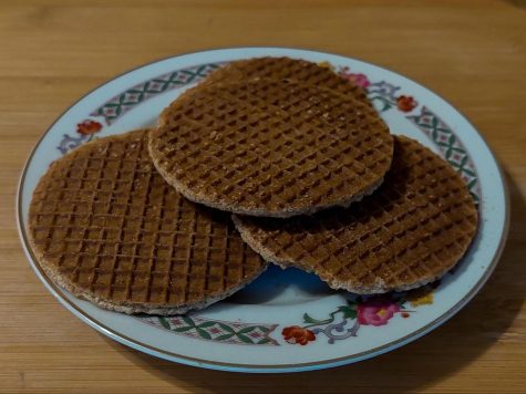 Freshly made stroopwafels sitting on a plate, ready to be eaten!